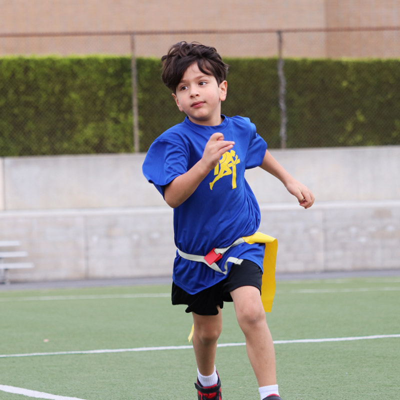 young boy camper running in his prime time tshirt